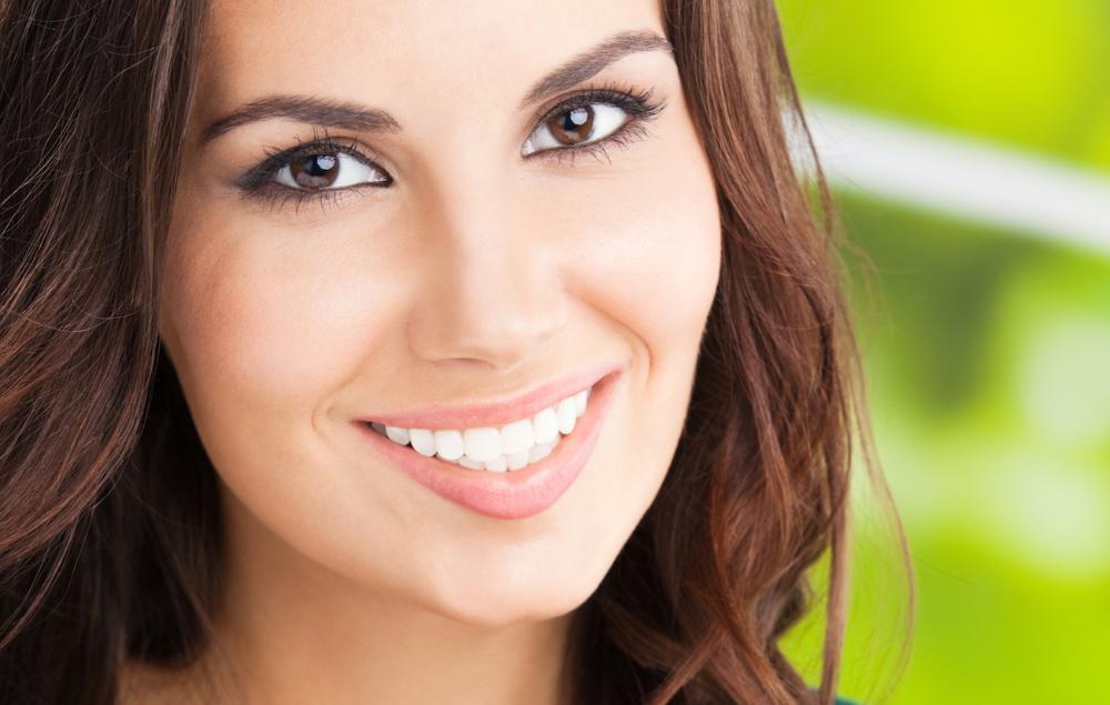 Patient smiling after tooth extraction treatment