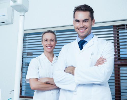 General dentist and hygienist smiling in Winston Salem NC